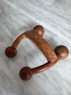 The Body Shop Wooden Handheld Massager in Brown.